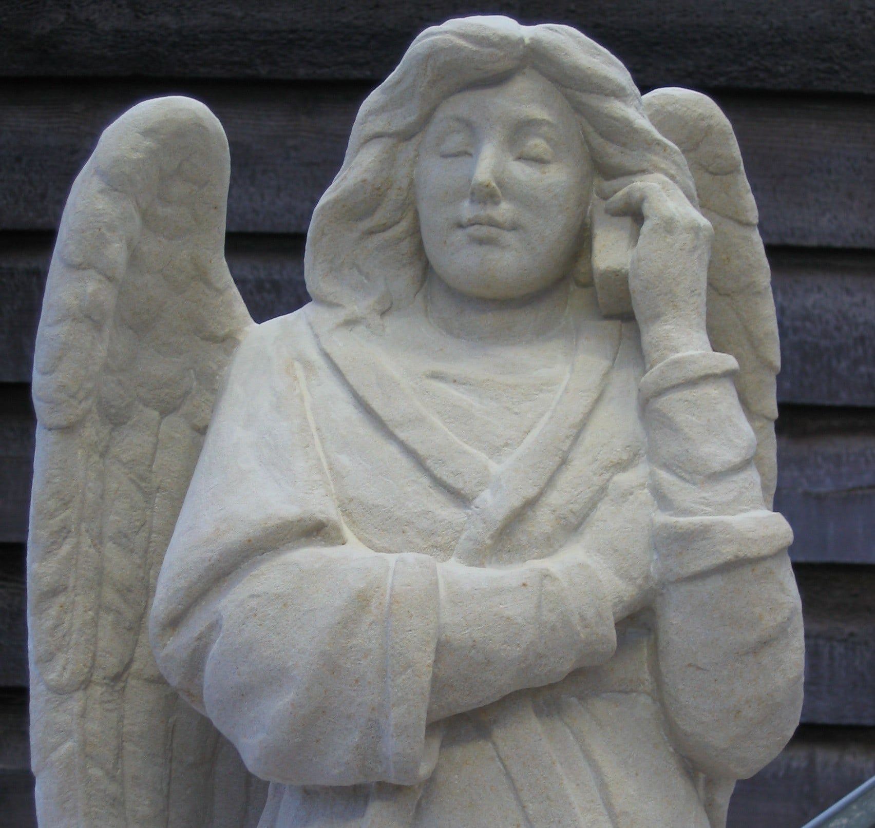 Visual of Angel with Cellphone adorns Cathedral